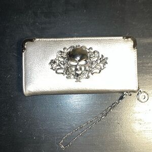 Silver Wristlet Wallet with Decorative Skull Emblem